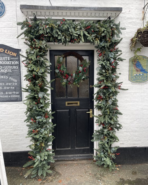 Foliage garland framing a front door