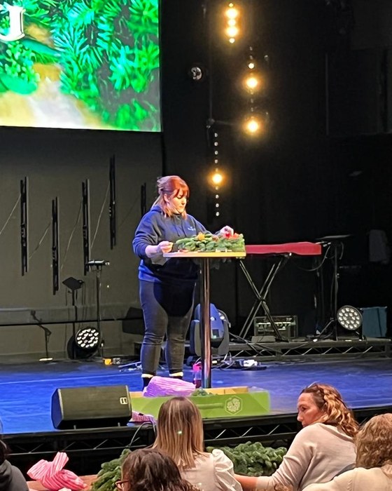 Our florist leading a wreath workshop on stage