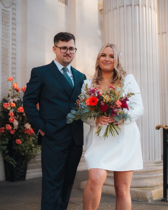 Couple with a red rose bouquet